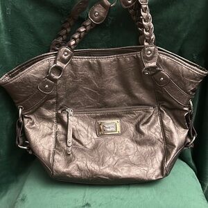 New Rosetti purse,lots pockets,lots of room and space(I only sell through Posh)